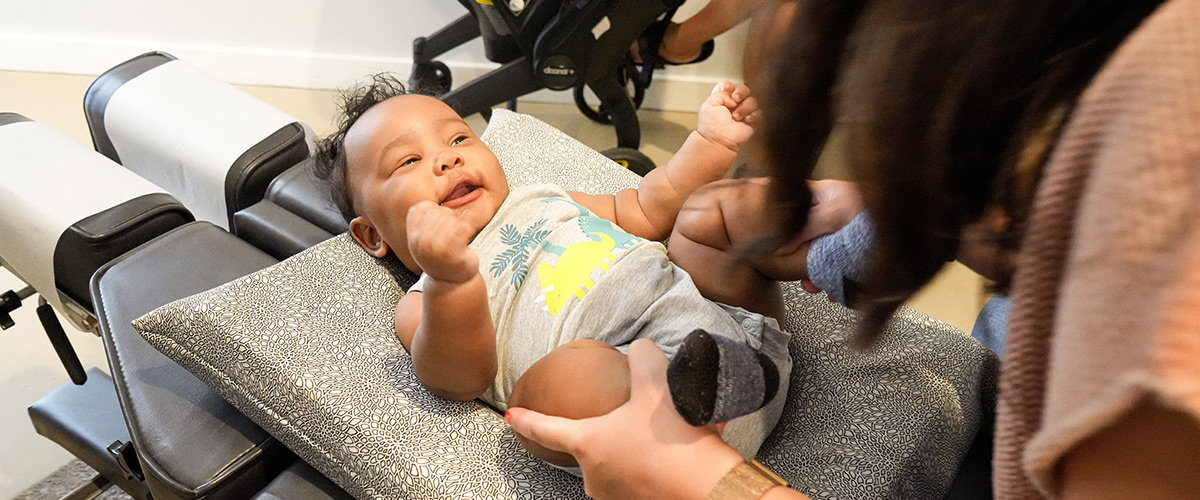 baby-smiling-at-chiro-wide