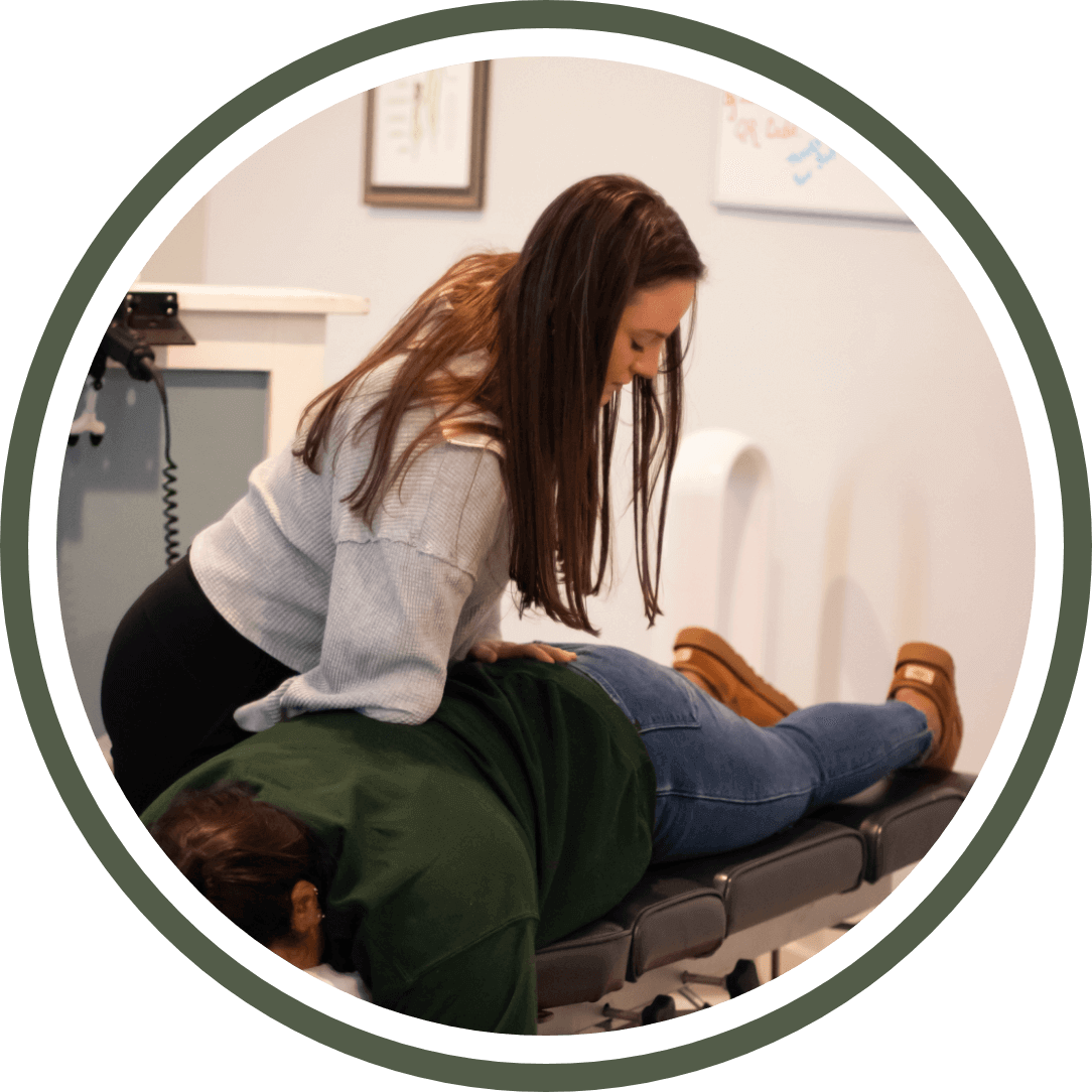 img-new-practice-members@2x Chiropractor providing care to a patient on an adjustment table at Foundation Family Chiropractic, emphasizing personalized treatment for family wellness.